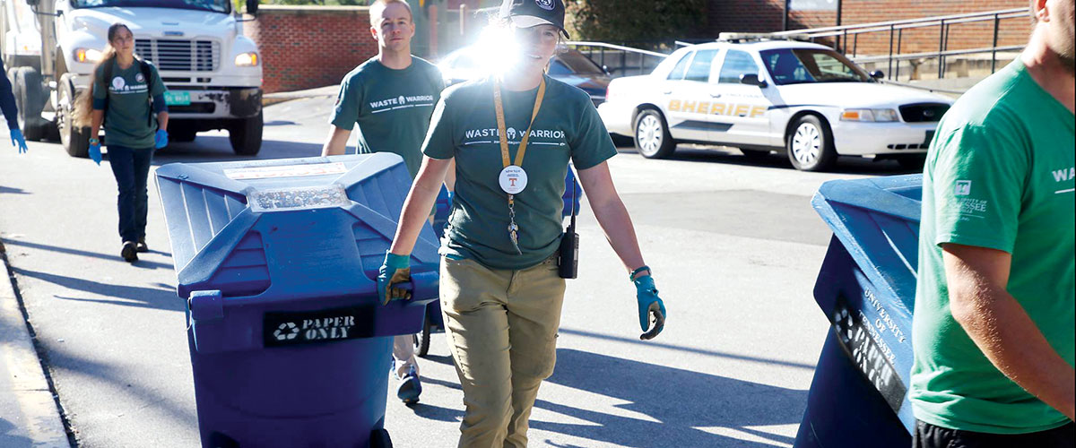 Waste Warriors pulling recycling bins